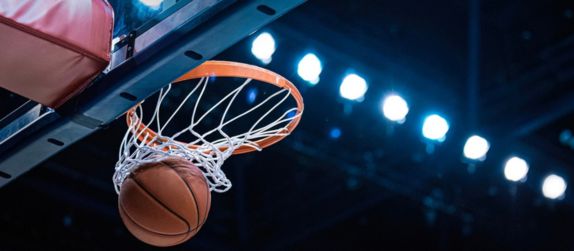 a basketball falling through a hoop