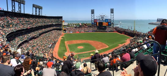 oracle park filled with baseball fans overlooking the bay